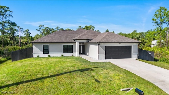 view of front facade with a front yard and a garage