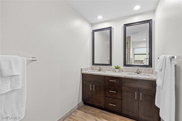 bathroom featuring vanity and wood-type flooring