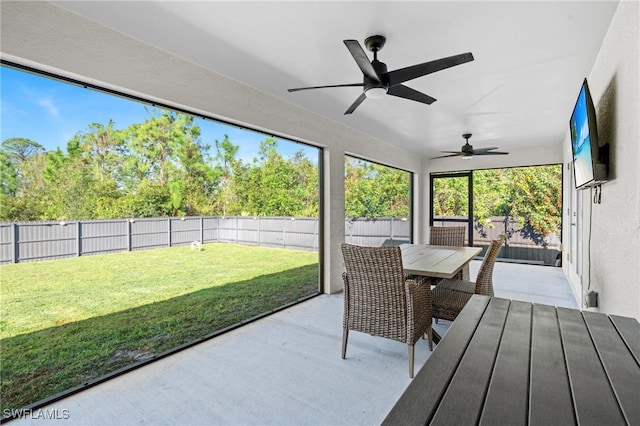 sunroom / solarium with ceiling fan