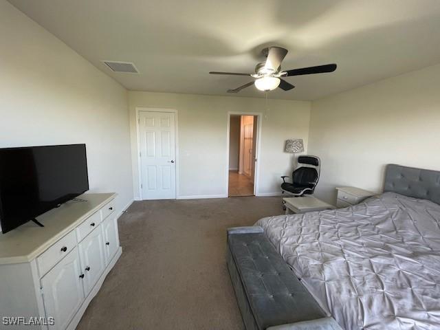 bedroom featuring ceiling fan and carpet