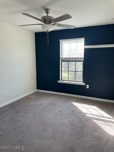 carpeted empty room with ceiling fan