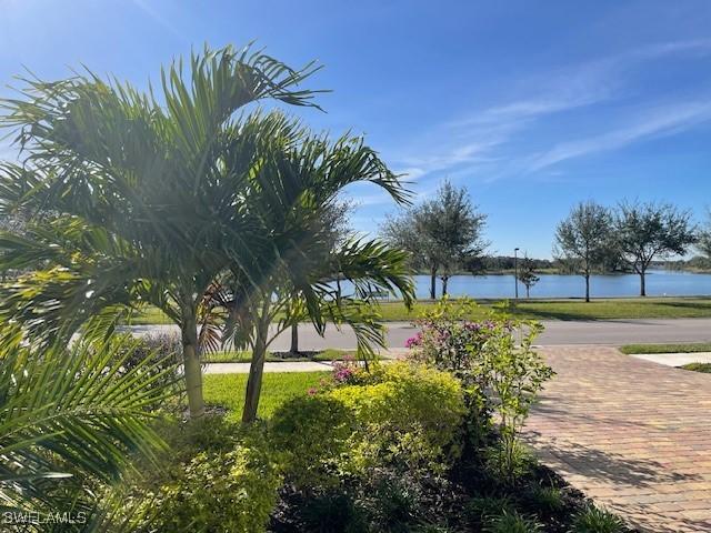 view of home's community with a water view