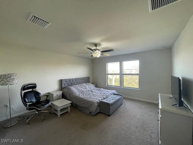 carpeted bedroom featuring ceiling fan