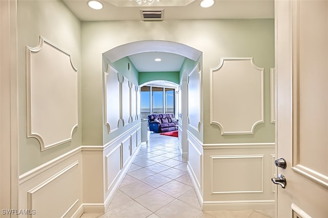 corridor featuring light tile patterned flooring