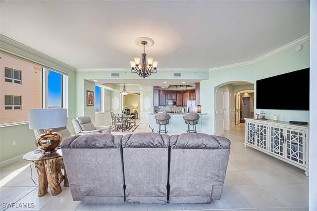 2104 W 1st St Unit 3204, Fort Myers, FL 33901 - living area featuring arched walkways, a notable chandelier, ornamental molding, and visible vents