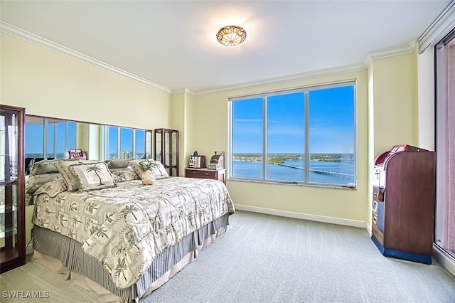 bedroom featuring a water view, light colored carpet, and ornamental molding