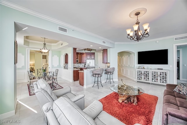 2104 W 1st St Unit 3204, Fort Myers, FL 33901 - living area with crown molding, arched walkways, visible vents, and a notable chandelier