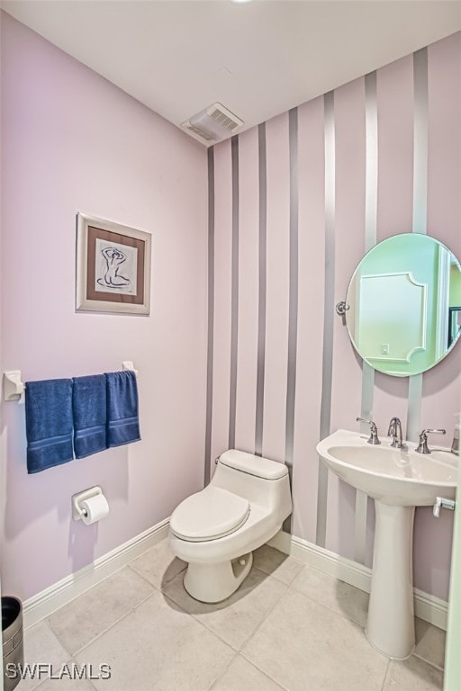 bathroom with tile patterned floors and toilet