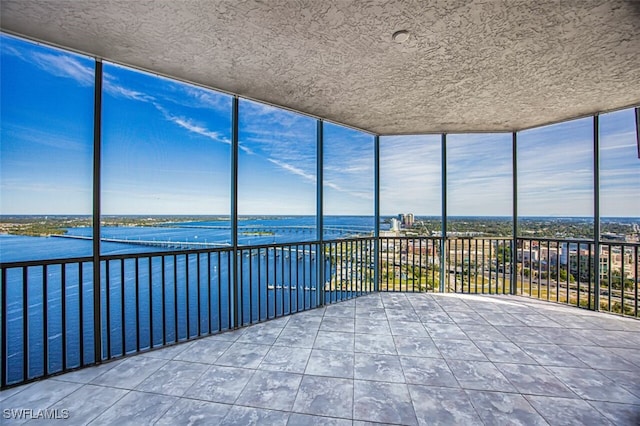 2104 W 1st St Unit 3204, Fort Myers, FL 33901 - unfurnished sunroom featuring a water view