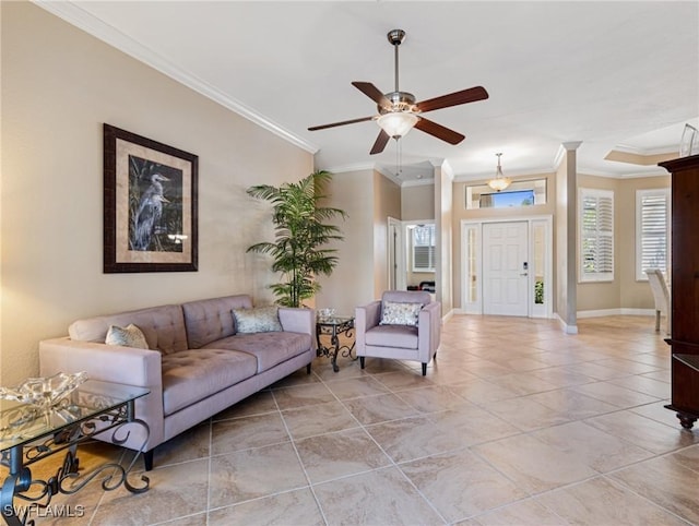 living room featuring ceiling fan and ornamental molding