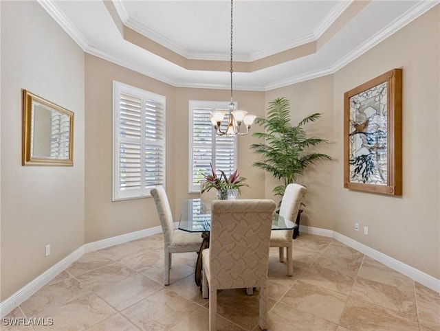 20838 Torre Del Lago St, Estero, FL 33928 - dining area featuring a chandelier, a raised ceiling, crown molding, and baseboards