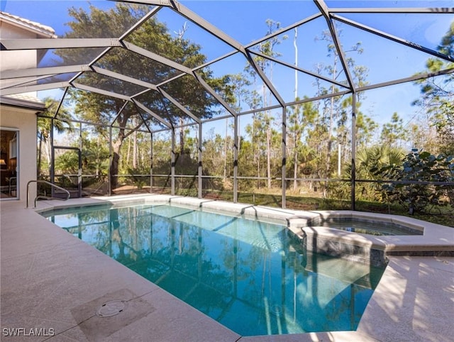 view of swimming pool featuring a lanai, an in ground hot tub, and a patio