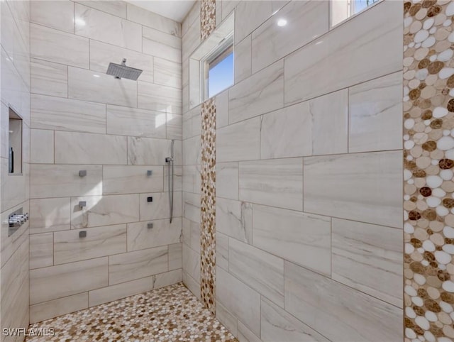 bathroom featuring tiled shower