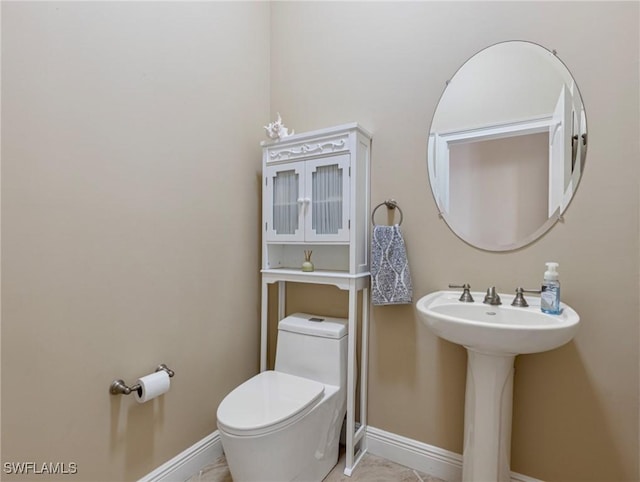 bathroom featuring toilet