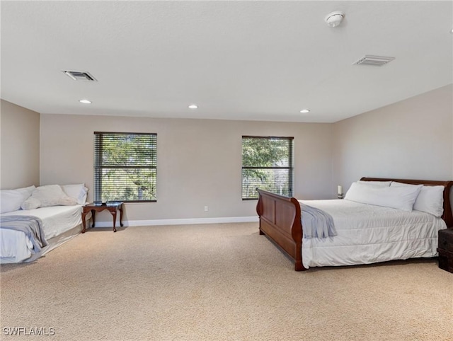 bedroom featuring light carpet