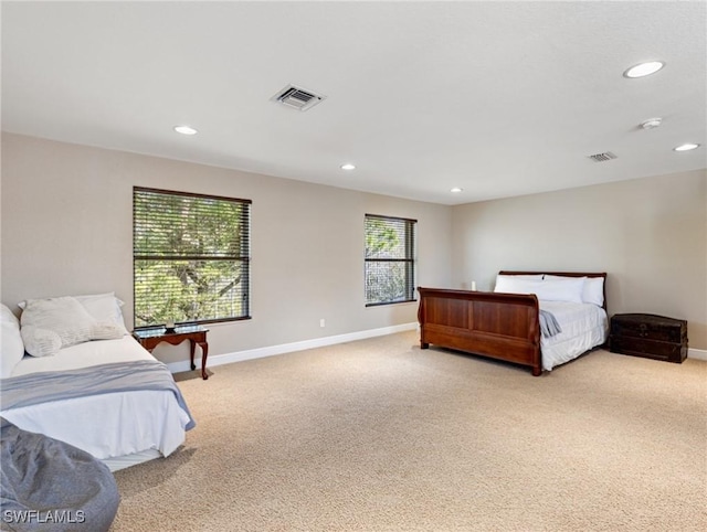 bedroom featuring light colored carpet