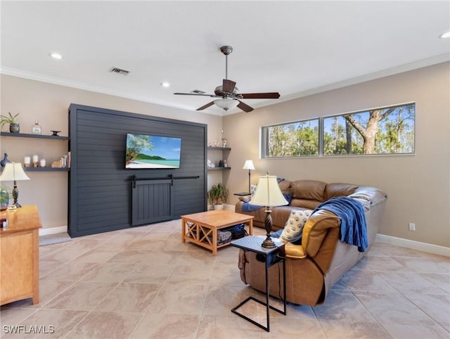 living room with ceiling fan and ornamental molding