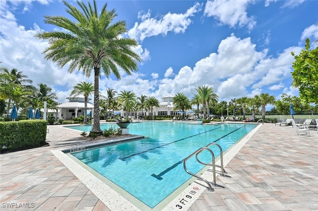 view of swimming pool featuring a patio area