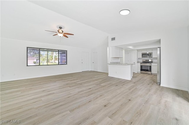 unfurnished living room with light wood-type flooring, ceiling fan, and lofted ceiling