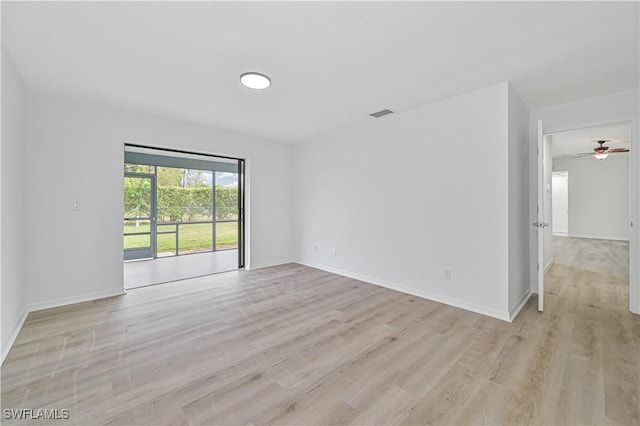 unfurnished room with light hardwood / wood-style flooring