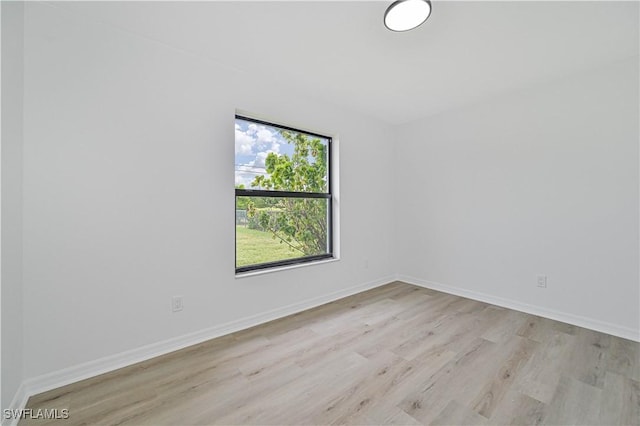 unfurnished room featuring light hardwood / wood-style flooring