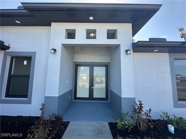 entrance to property featuring french doors