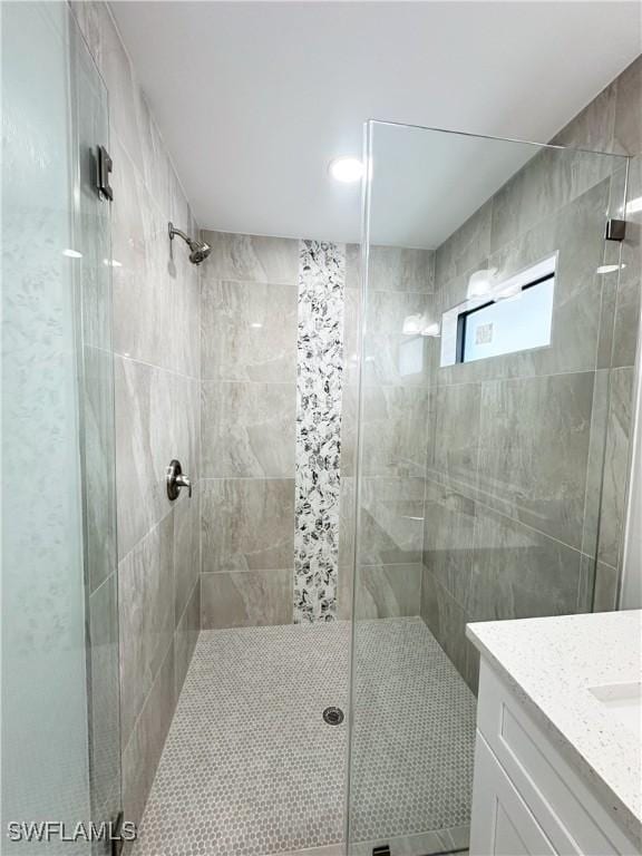 bathroom with vanity and walk in shower