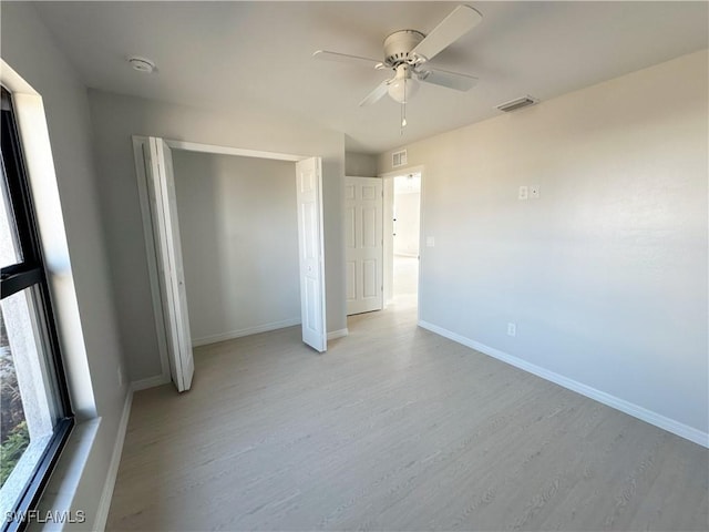 unfurnished bedroom featuring a closet, ceiling fan, and light hardwood / wood-style flooring