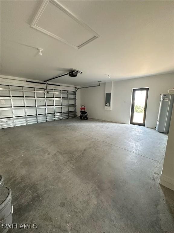 garage featuring electric panel and water heater