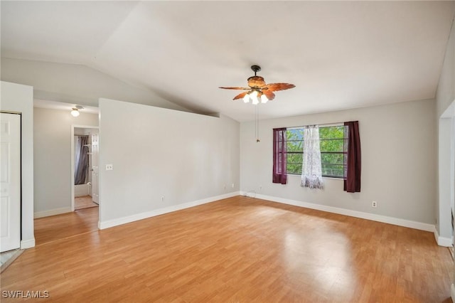 empty room with light wood-type flooring, ceiling fan, and lofted ceiling