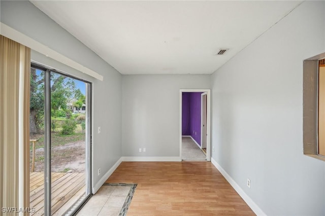 unfurnished room with light hardwood / wood-style floors