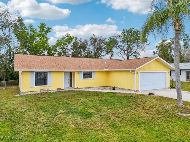 single story home featuring a garage and a front lawn