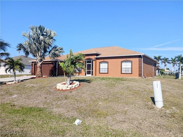 ranch-style house with a front yard and a garage