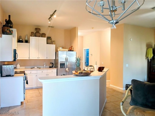 kitchen featuring white cabinetry, a center island, stainless steel fridge with ice dispenser, a chandelier, and light tile patterned floors