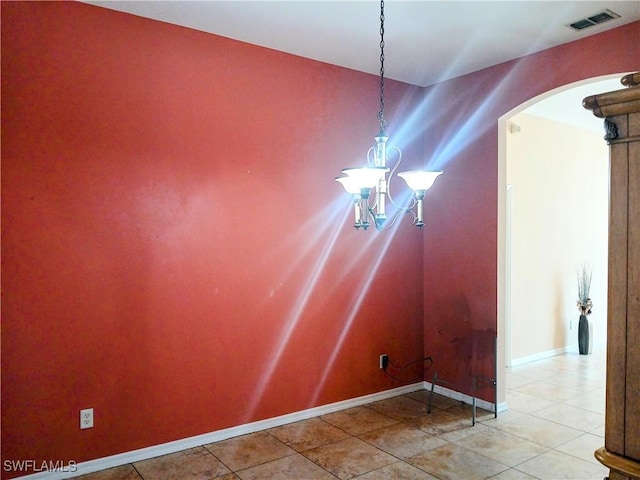 unfurnished dining area featuring tile patterned floors