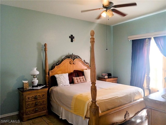 tiled bedroom with ceiling fan