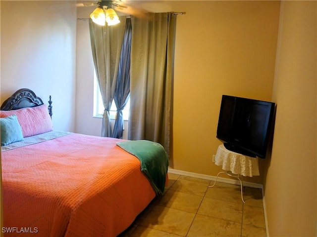 bedroom featuring ceiling fan and light tile patterned floors