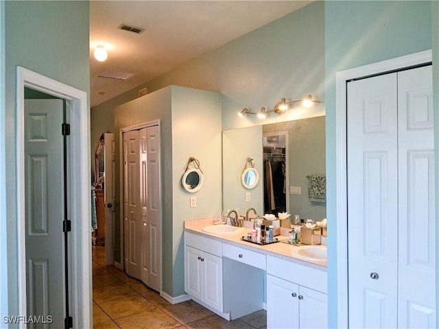 bathroom featuring tile patterned floors and vanity