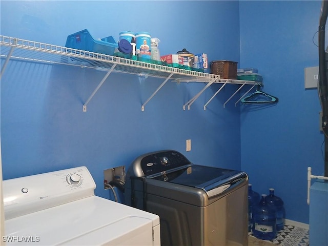 laundry room featuring separate washer and dryer