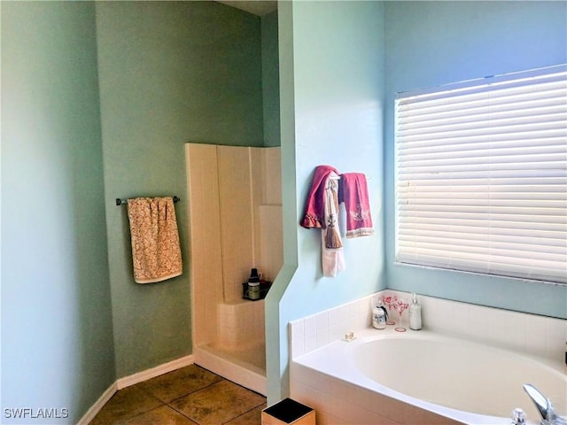 bathroom featuring separate shower and tub and tile patterned floors