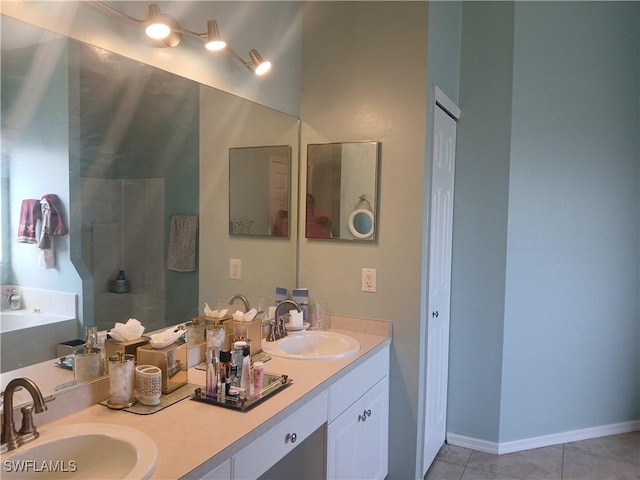 bathroom featuring tile patterned flooring and vanity