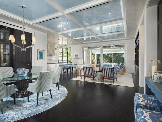 dining space with beam ceiling, a chandelier, coffered ceiling, and hardwood / wood-style flooring