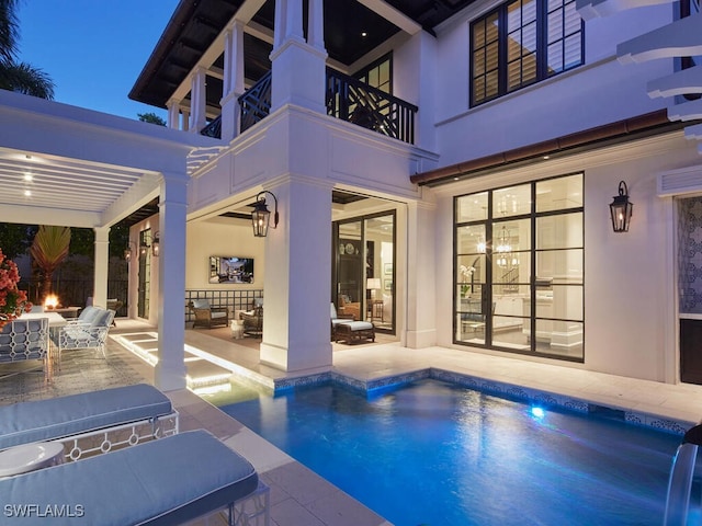 view of pool featuring a patio and a hot tub