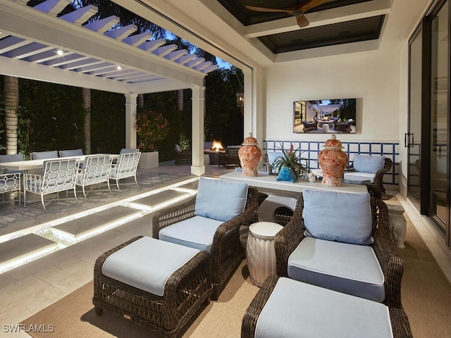 view of patio featuring ceiling fan