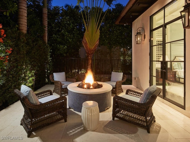 patio at night with an outdoor fire pit