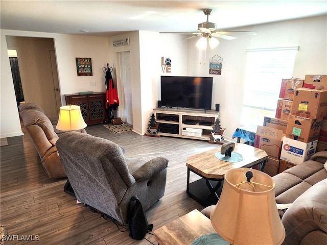 living room featuring hardwood / wood-style flooring and ceiling fan