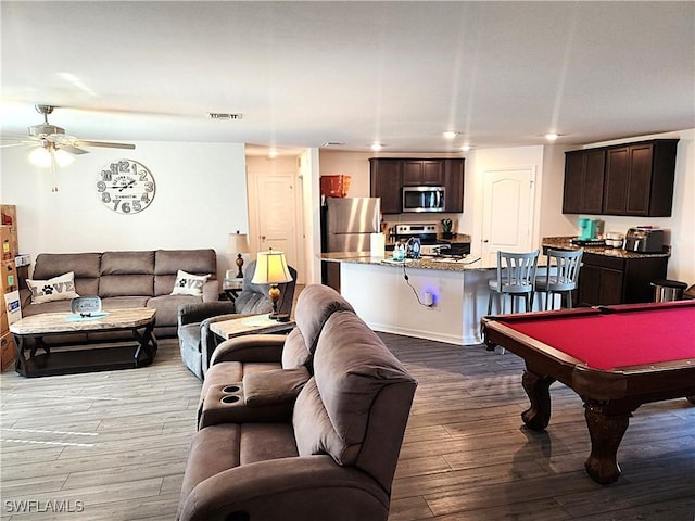 game room featuring light wood-type flooring, ceiling fan, and billiards