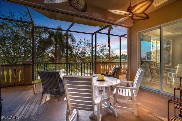 sunroom with ceiling fan