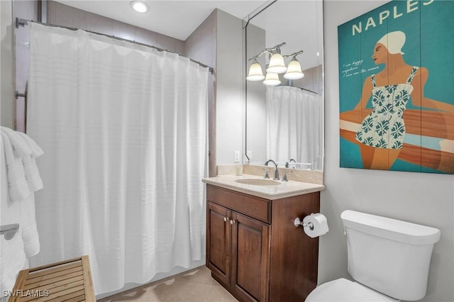 bathroom featuring tile patterned flooring, vanity, toilet, and a shower with curtain