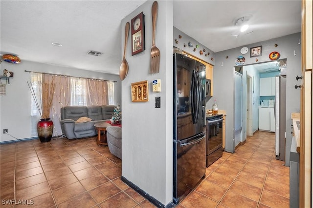 kitchen featuring black appliances and tile patterned floors